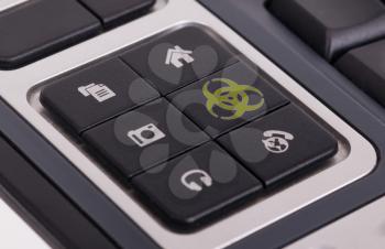 Buttons on a keyboard, selective focus on the middle right button - Biohazard
