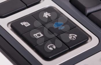 Buttons on a keyboard, selective focus on the middle right button - Cloud