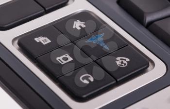 Buttons on a keyboard, selective focus on the middle right button - Doctor