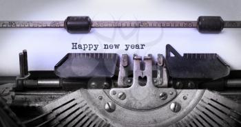 Close-up of a vintage typewriter, old and rusty, happy new year