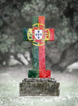 Old weathered gravestone in the cemetery - Portugal
