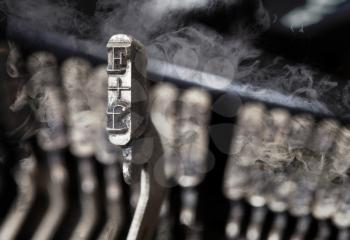 F hammer for writing with an old manual typewriter - mystery smoke