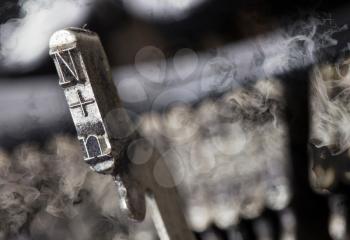 N hammer for writing with an old manual typewriter - mystery smoke