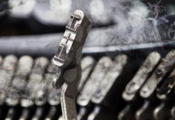 L hammer for writing with an old manual typewriter - mystery smoke