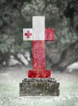 Old weathered gravestone in the cemetery - Tonga