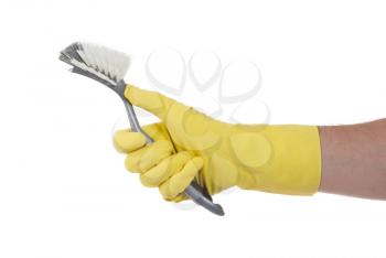Hand with a protection glove holding a dish-brush