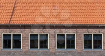 Very old red roof on dutch style house