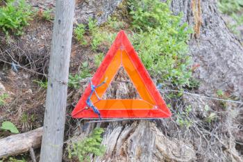 Warning triangle on a metal fence in Switzerland