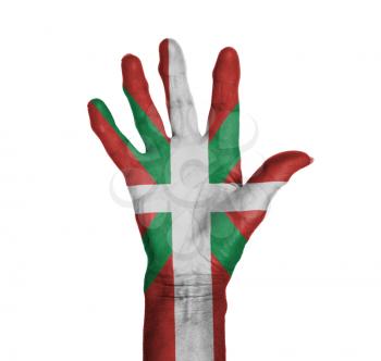Palm of a woman hand, painted with flag of Basque Country