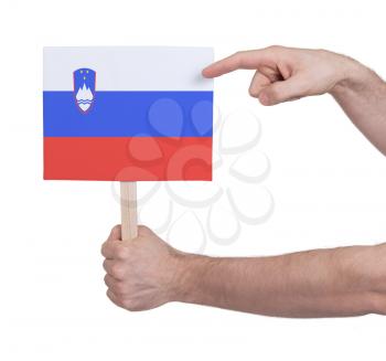 Hand holding small card, isolated on white - Flag of Slovenia