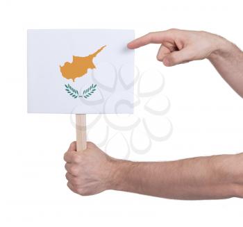 Hand holding small card, isolated on white - Flag of Cyprus