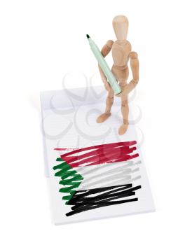 Wooden mannequin made a drawing of a flag - Sudan