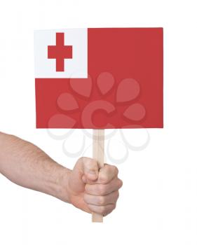 Hand holding small card, isolated on white - Flag of Tonga