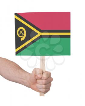 Hand holding small card, isolated on white - Flag of Vanuatu