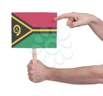 Hand holding small card, isolated on white - Flag of Vanuatu