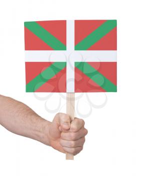 Hand holding small card, isolated on white - Flag of Basque Country