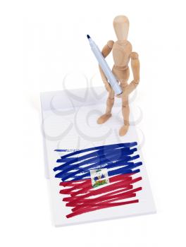 Wooden mannequin made a drawing of a flag - Haiti
