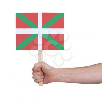 Hand holding small card, isolated on white - Flag of Basque Country