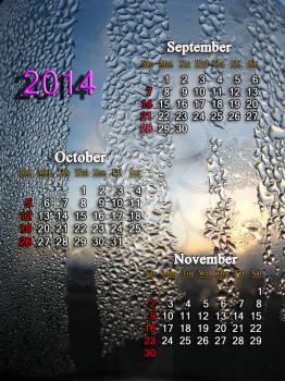 calendar for autumn of 2014 year with surface of drops of water