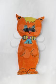 children's drawing with beautiful red cat cut out on the paper