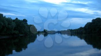 the beautiful summer landscape with river and trees in the everning