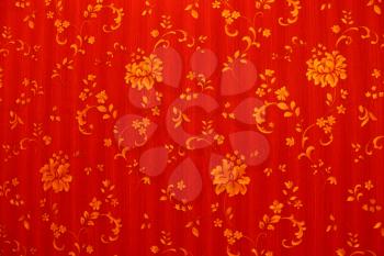 Image of abstract red background with golden flowers