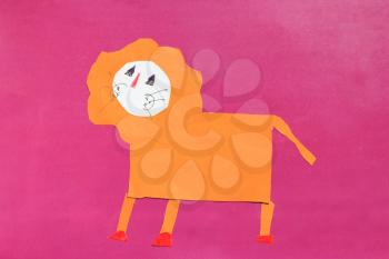 image of children's odd job of orange lion on the red background