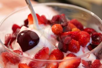 tasty icecream with berries of cherry and wild strawberry