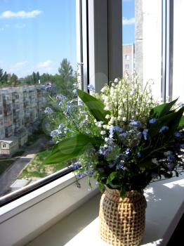 Beautiful bouquet of lilies of the valley and blue flowers
