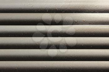 gray strips of jalousie horizontal on the window