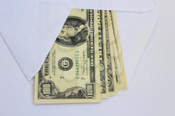 dollar bank notes in envelope as a bribe isolated on a white background