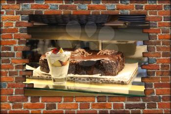 hole in the brick wall and view to counter with ice-cream and cakes