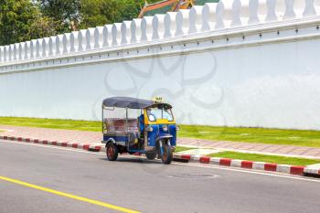 Traditional taxi tuk-tuk in Bangkok, Thailand in a summer day