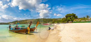 Panorama of Traditional thai longtail boat at Log Dalum Beach on Phi Phi Don island, Thailand in a summer day
