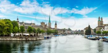 Panorama of Historical part of Zurich with famous Fraumunster and Grossmunster churches in a beautiful summer day, Switzerland