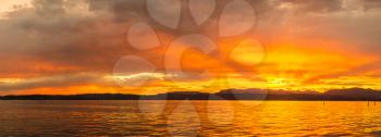 Panorama of Sunset on Garda lake in Italy in a beautiful summer evening