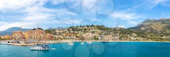 Panorama of Colorful old town and beach in Menton on french Riviera in a beautiful summer day, France