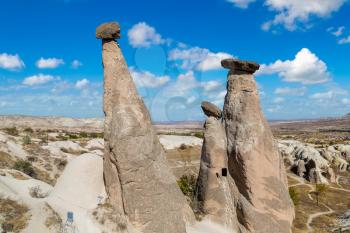 Three Graces (Three Beautifuls) rock hills in Devrent valley in Cappadocia, Nevsehir, Turkey in a beautiful summer day