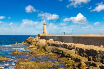 The lighthouse in historical Kyrenia harbour in North Cyprus in a beautiful summer day