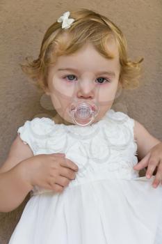 Image of cute baby girl with tear