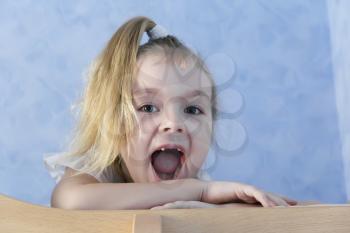 Image of blond preschooler with open mouth