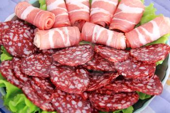 Image with appetizing sausage and meat on the table