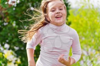 Photo of cute running girl in summer
