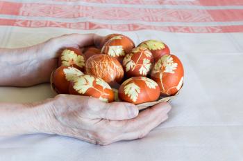 Photo of Easter eggs in woman hands