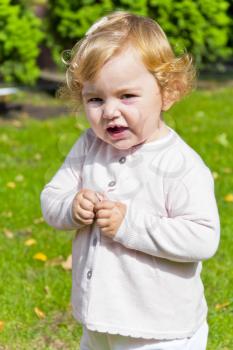 Cute baby girl with curly blond hair