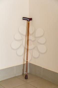 Walking stick leaning to the wall indoor hospital