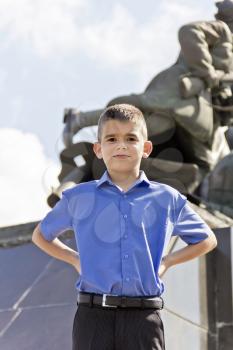 Cute brunette boy eleven years old in monument background