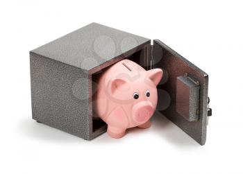 Piggy bank in a safe. Isolated on white