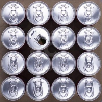 Red soda cans, top view, with one opened. Abstract background. Drinking sugar reach drinks, beer cans, carbonated drinks concept.