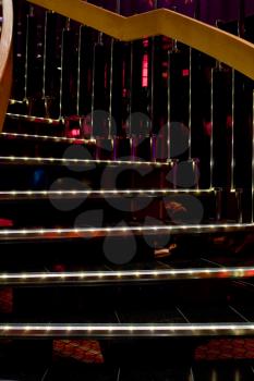illuminated spiral stairs in disco club on cruise liner
